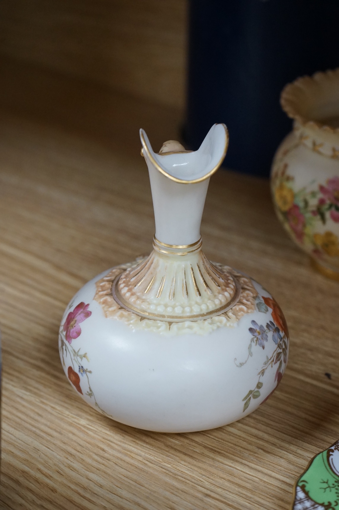 A Worcester butterfly handled cup and saucer and four other items, together with Royal Crown Derby, Dresden and Coalport items. (9). Tallest 13 cm